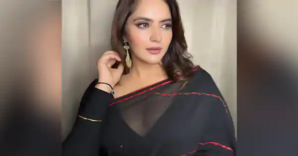 anjali anand in black saree deep neckline blouse nose ring